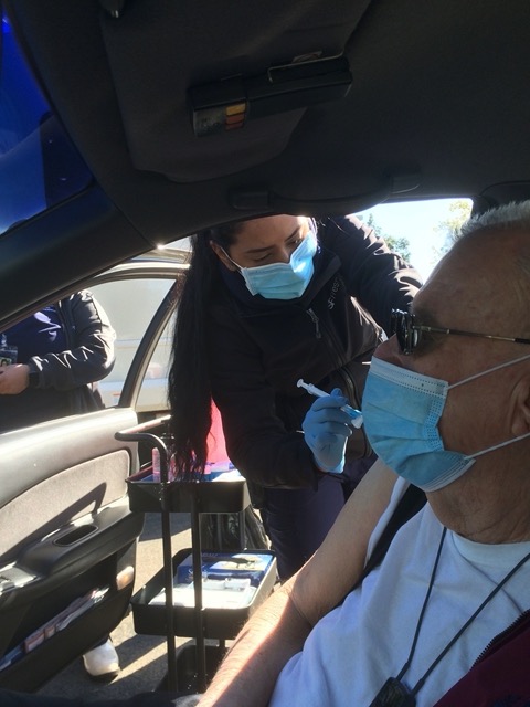 My Dad getting his shot in Fresno on February 12