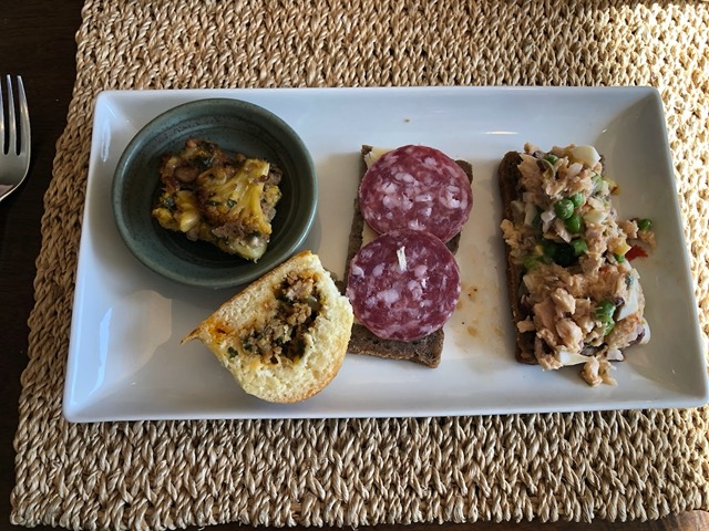 Cauliflower kuku, pierogi, rye with salami & cheese, and with tuna salad