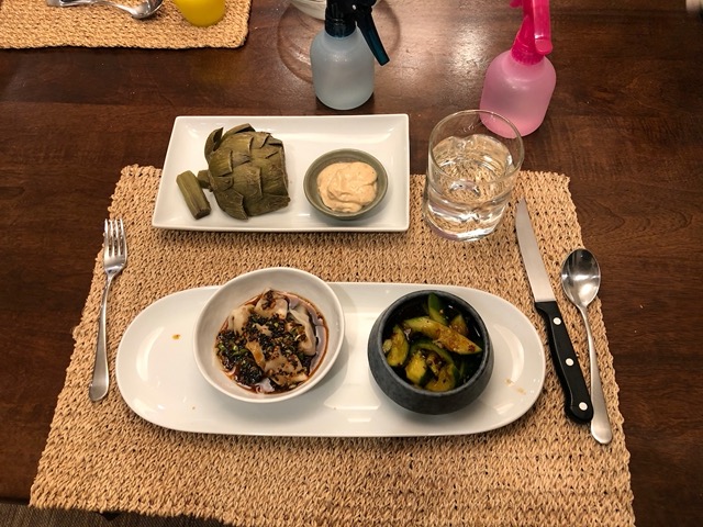 Wontons in red oil, Sichuan cucumber salad, and artichokes