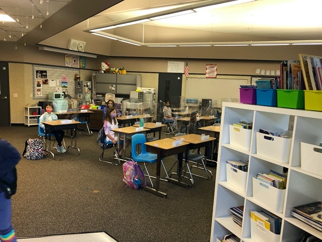 Desks were separated and shielded.  Kids wore masks