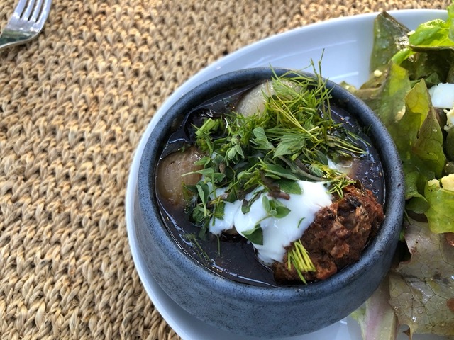 With lots of herbs on top