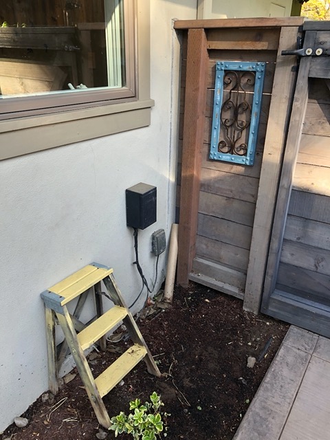 'Before' picture of the corner by the gate