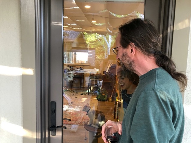 They're hard to see -- he's behind the glass door -- zoom in to see them