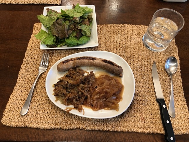 Brats with a mess of onions, sauerkraut, and hashbrowns (we don't normally eat like this haha)