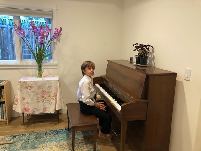Owen getting ready to film his piano recital pieces