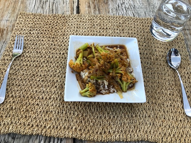 Sichuan stir fried sweet-stem cauliflower on rice