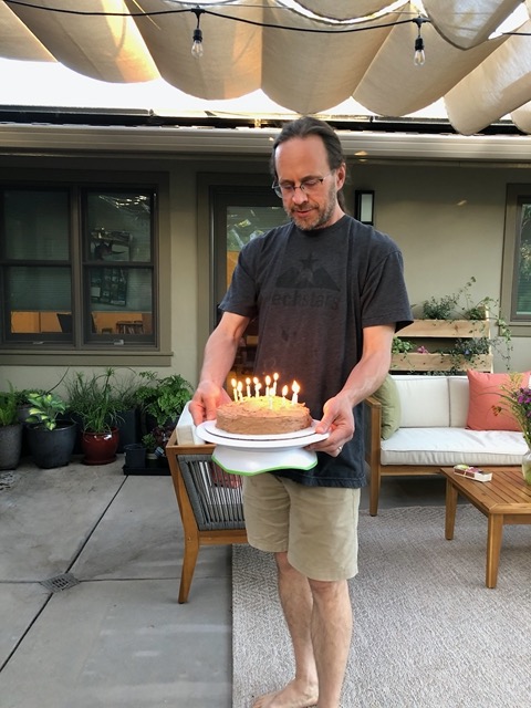Mike bringing out the cake