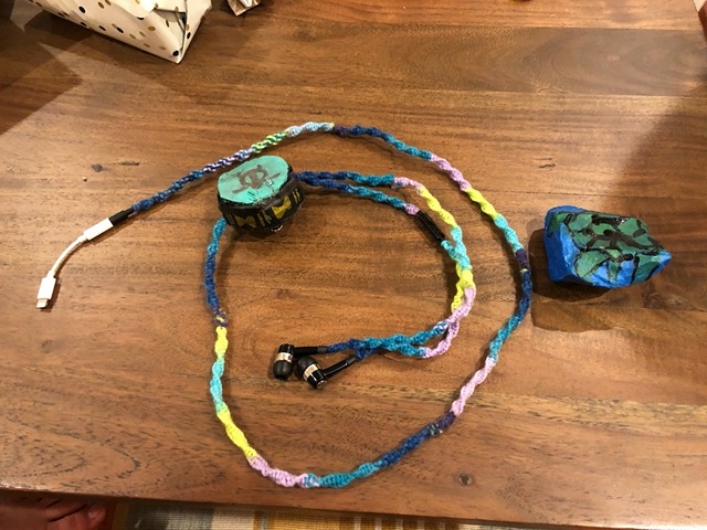 Ellie wove me an earbud wire cover, with holder, for my apron!