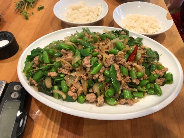 Thai stir fry with pork, sugar snaps, onions, and greens.  Delicious