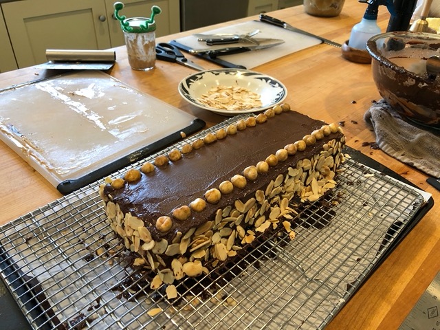 The dacquoise, with slivered almonds on the side and toasted hazelnuts on top