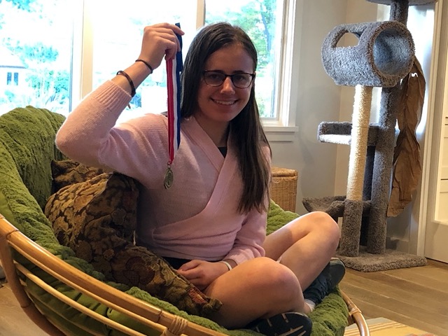 Lela with a gold medal from her Grand Concours, a French language exam!