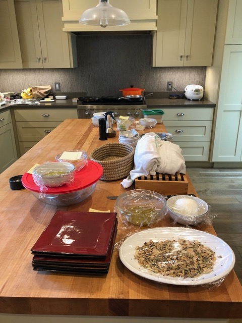 Salad fixings, and loaves of fresh bread