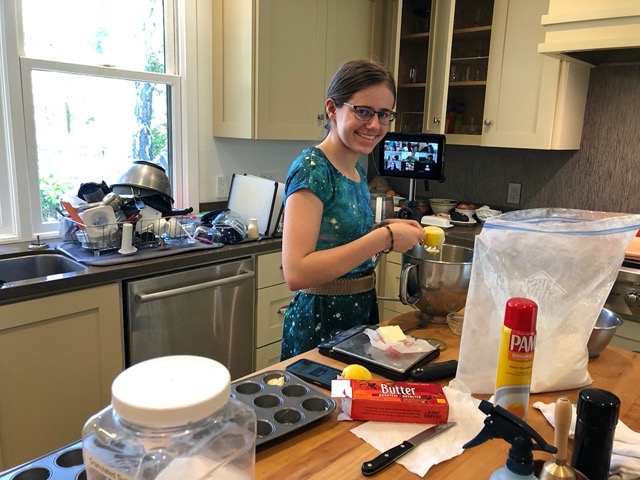 Lela making madeleines with her French class on Zoom