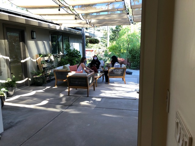 The girls playing on the patio