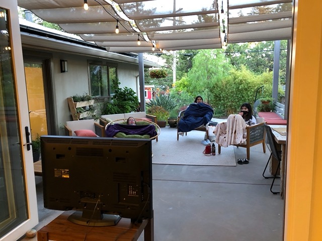 Watching a movie on the patio