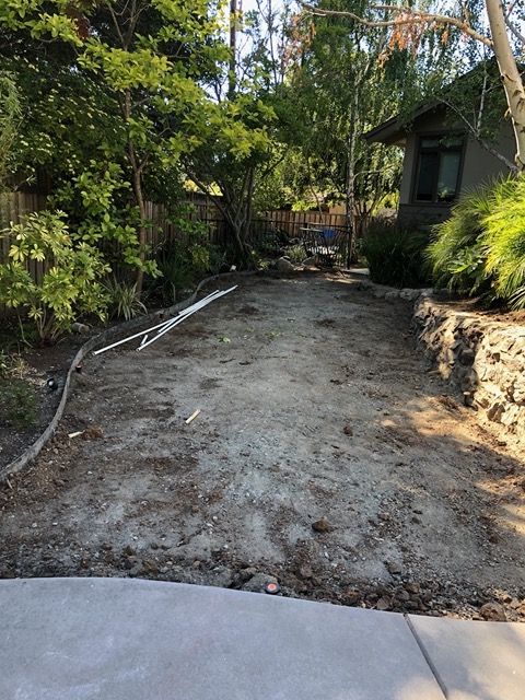The former putting green, with new irrigation pipe