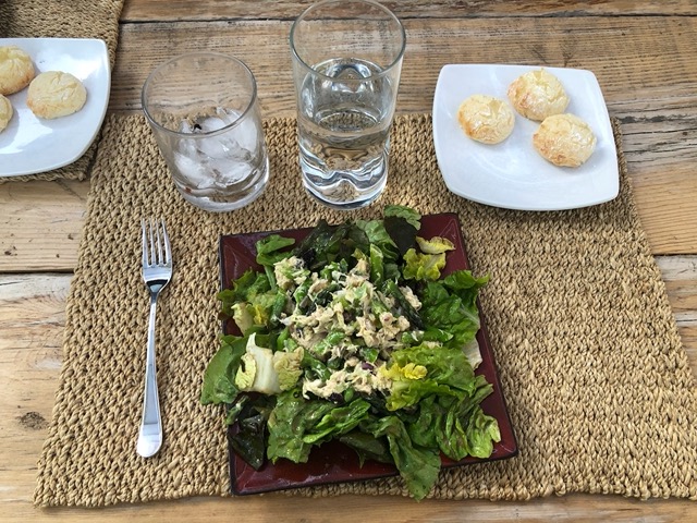 Tuna salad with green beans on bed of lettuce, with Brazilian cheese breads