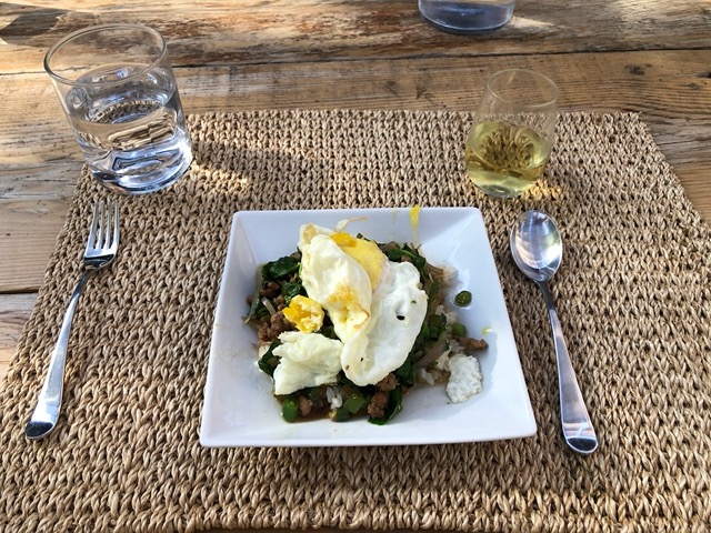 Fried egg on Thai stir fry of pork and green beans