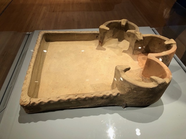 Portable stove from a shop: fires would be placed in each cubby, to heat a little pot placed on top