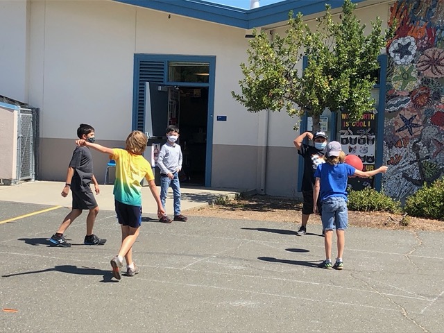 Jake is the one with the grey shirt and long jeans