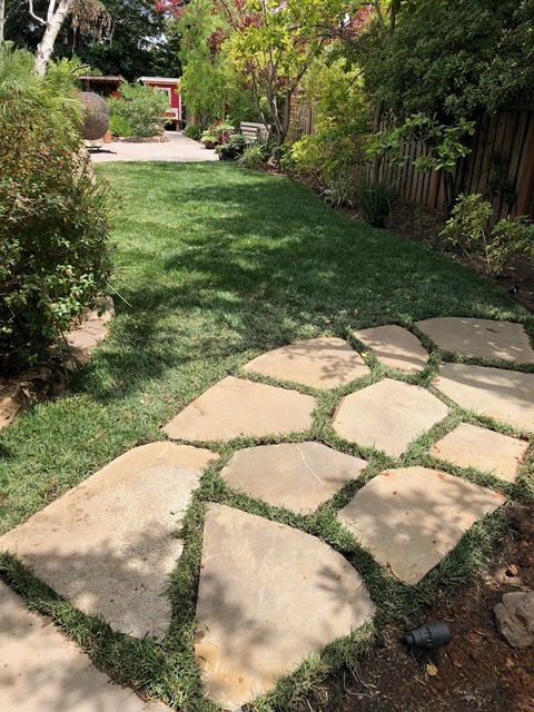 The landscapers cut a hole for each stone. Gaps are 4
