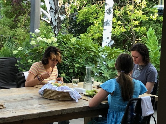 They had dinner on the patio: salad, ragu bolognese, fresh bread