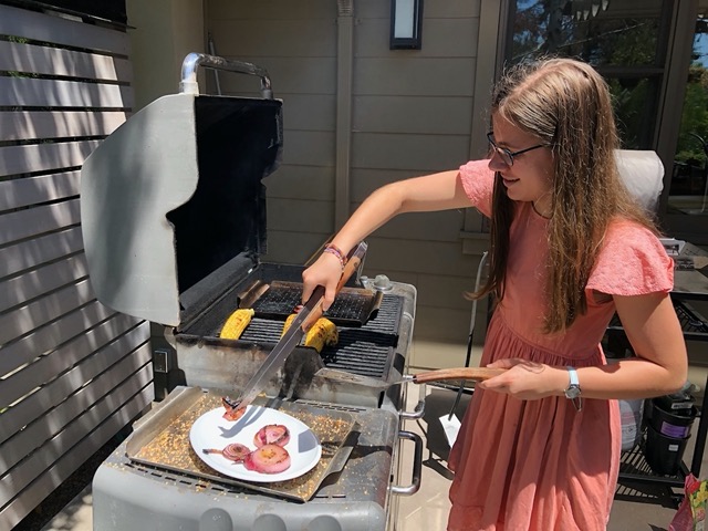Teaching Lela more about grilling