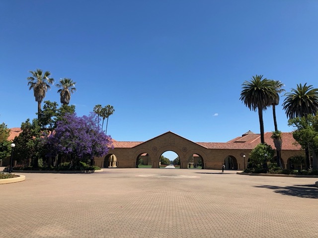 Beautiful blue sky over the quad, with one tiny cloud