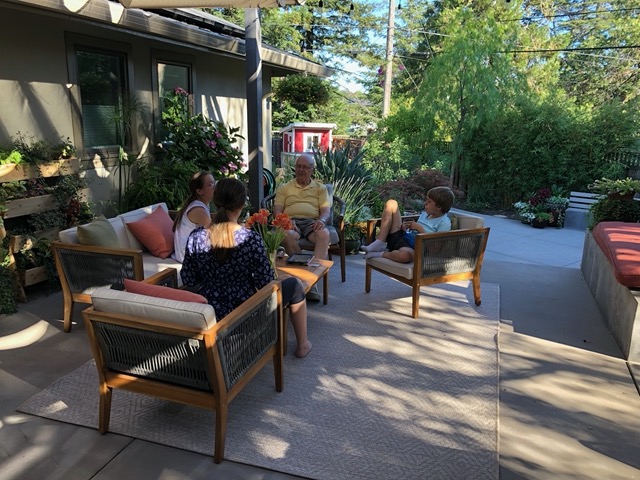 The kids chatting with Grandpa Mark on the patio