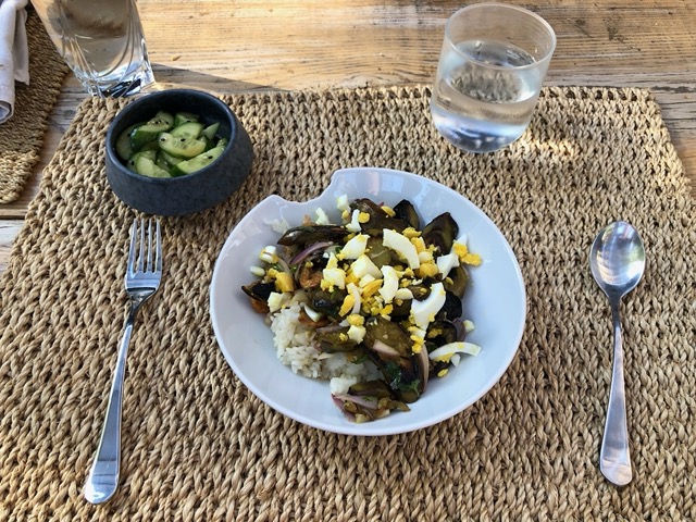 Pan fried eggplant with boiled egg on rice