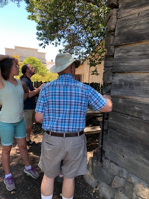 Visiting a settler's cabin across the street from the mission