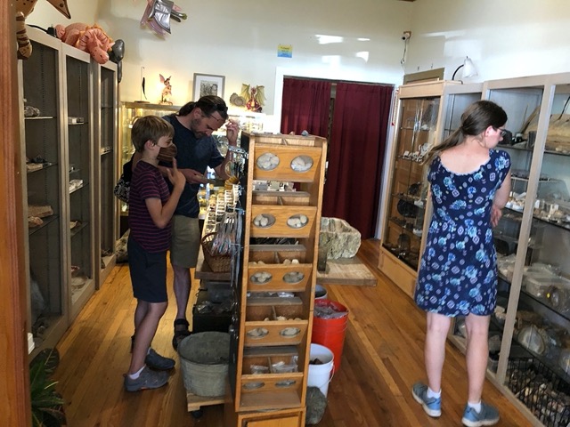 Mike, Lela and Owen in the rock shop.  Memories here of field trips to the mission