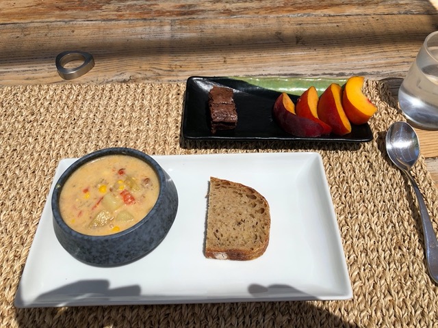 High summer meal of corn chowder and sourdough, and peach and brownie for dessert
