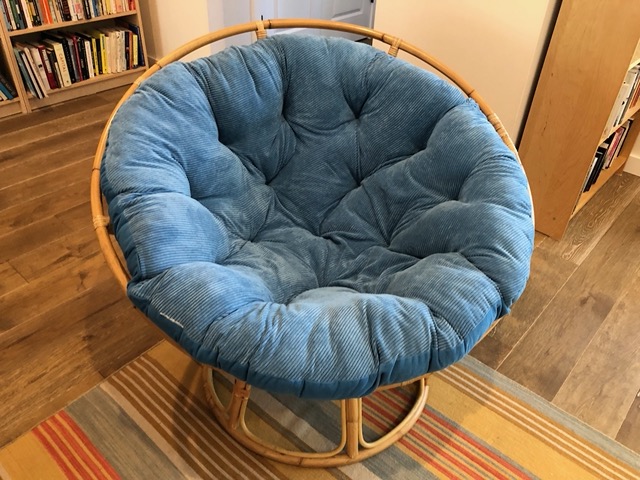 After several tries, I settled on this blue papasan cushion:  very comfortable and a good color