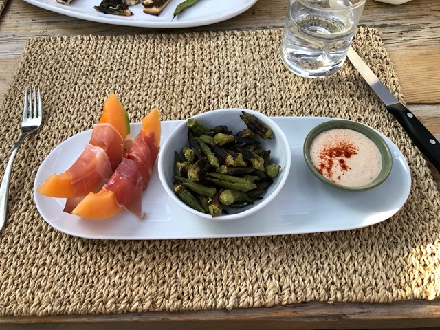 High summer dinner of melon and prosciutto, grilled okra, and chipotle aioli