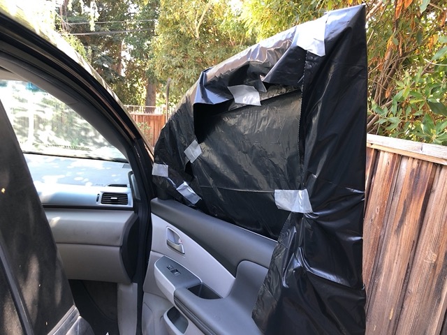 We drove the car into the side yard and taped up the window for our trip