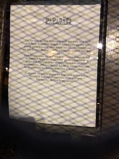 Sign on the door of a closed restaurant