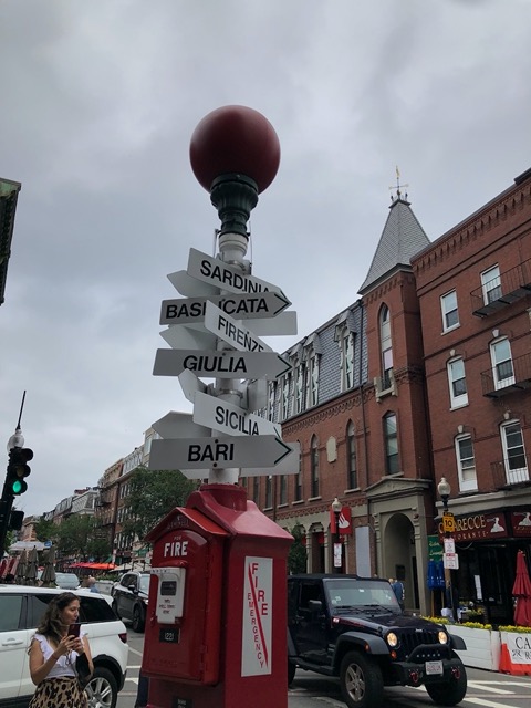 Street sign pointing to Italian cities (whispered voice: I don't think it's accurate)