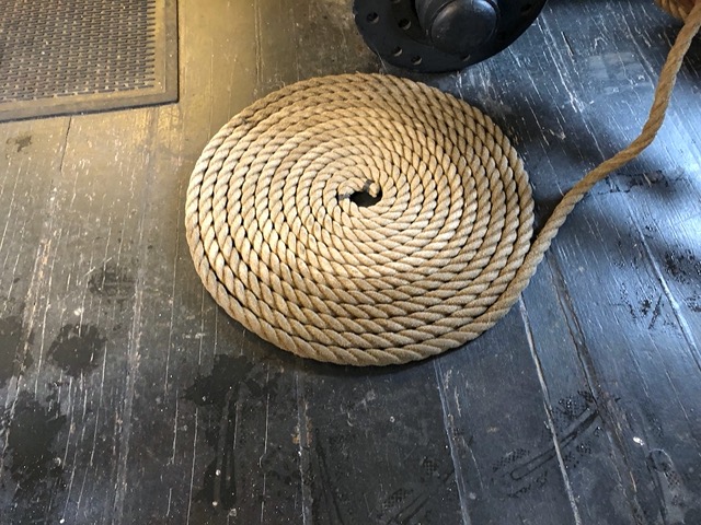 Very neat coil of rope.  Has to be neat to be safe