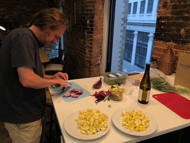 Mike prepping vegetables at the counter