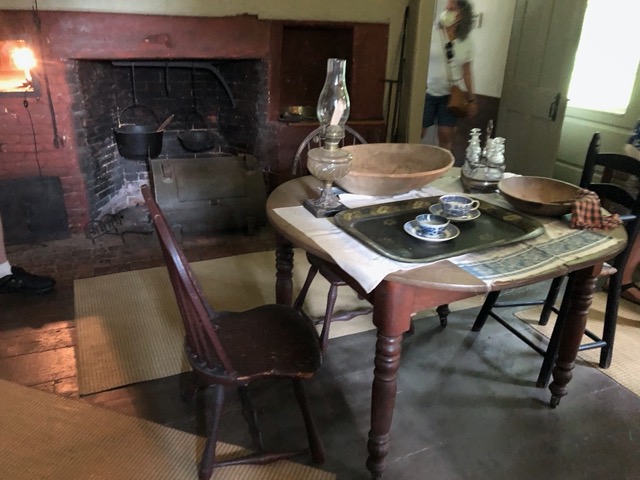Down in the kitchen. The fireplace was recently revealed