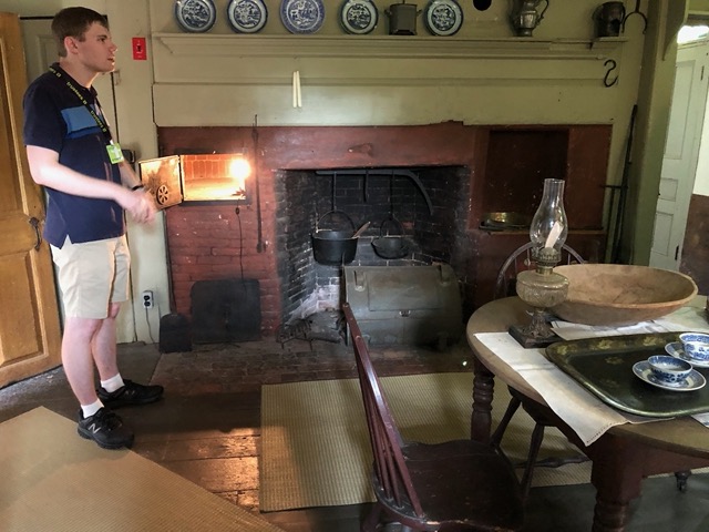 Our excellent guide, next to the hearth's oven (similar to Dingle Cottage in Orcop!)