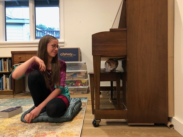 Exploring the next higher level in the room:  the piano bench