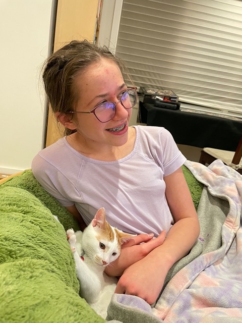 Ellie snuggling with the male in the papasan chair
