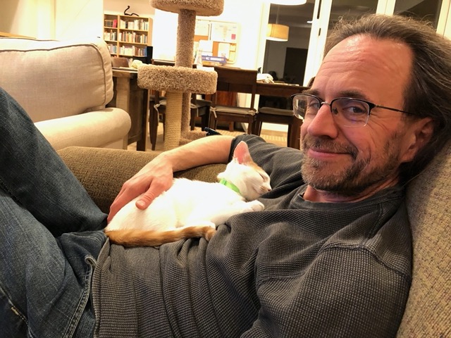 Happiness is a kitten sleeping on your chest