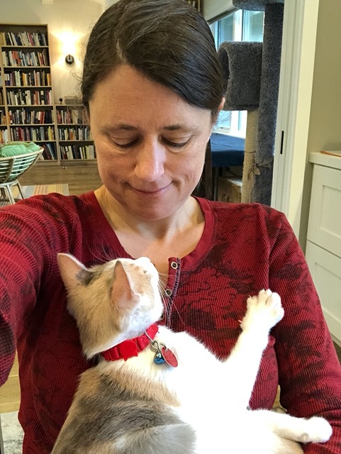 The female in my arms.  Relaxing, but paws still ready.