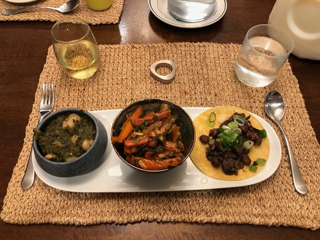 Beans in greens, roast carrots, and a bean taco