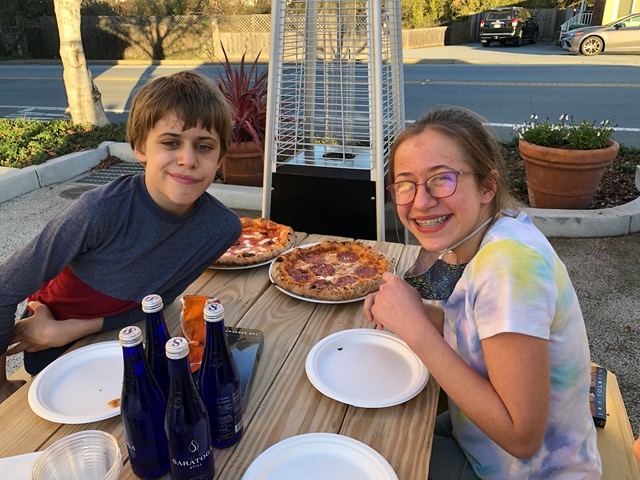 Ellie and Owen with the pizza