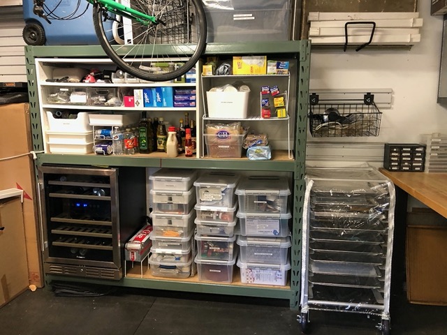 The shelves, now as deep pantry and task bins