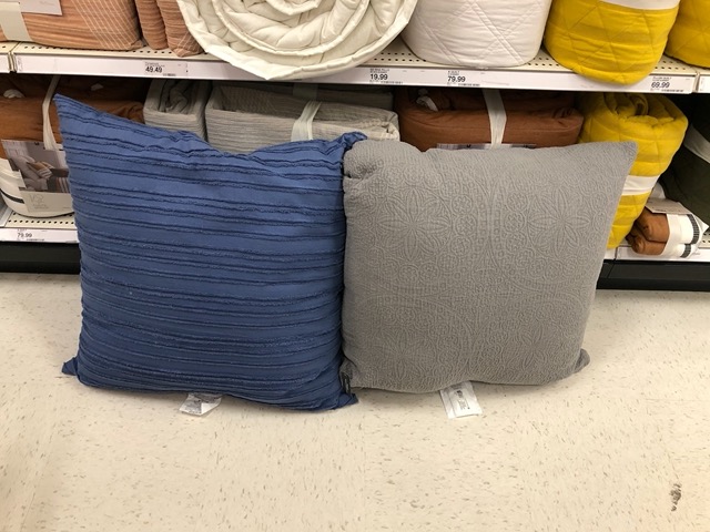 Choosing throw pillows for the window seat in the office